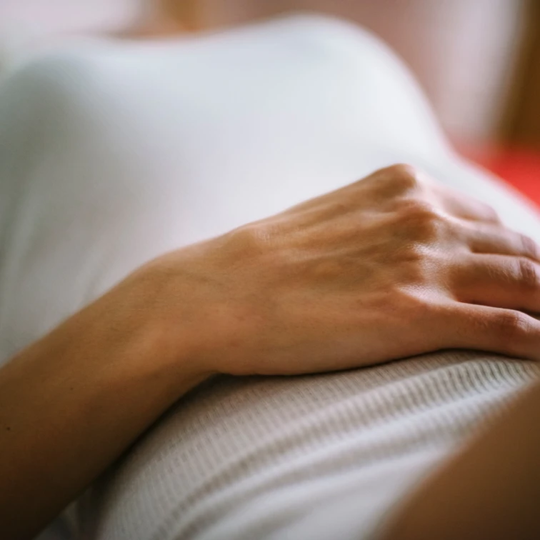 close up hand on stomach
