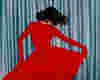 woman dancing in a red dress.