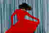 woman dancing in a red dress.