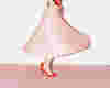 woman dancing in a pink skirt ona pink carpet