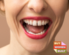 woman smiling with red lipstick with the Buy Woman Built Logo next to her