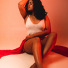 woman posing with red fabric